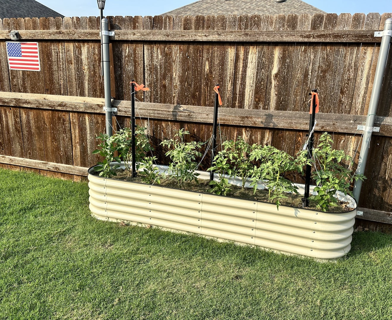 What are the benefits of using compost on modular metal raised garden beds?